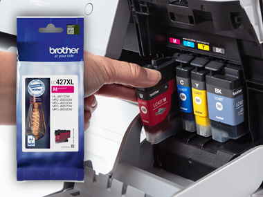 A customer inserting Brother toner cartridges into a Brother printer
